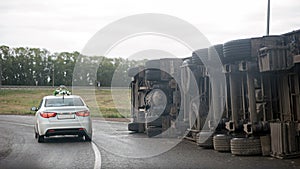 View of an overturned truck on highway in accident.