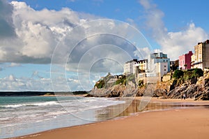 View of painted houses at Tenby,from Castle Beach.