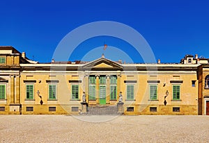 View of Palace of Pitty with garden and skyline of Florence, Italy. Boboli gardens in Florence, a couple walking in an arched path