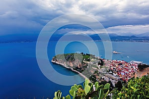 View from Palamidi on Nafplio city in Greece with port, Bourtzi fortress, and blue Mediterranean sea