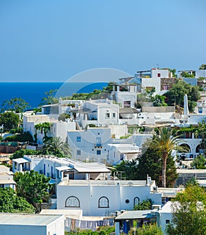 A view of Panarea island with typical white houses, Italy.