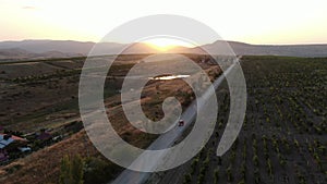 View of the panorama from the mountain ranges and vineyards of the mongering. The last rays of the sun shine in leaves