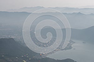 View of paragliders over Pokhara, Nepal from Sarangkot hill