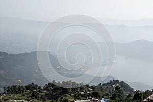 View of paragliders over Pokhara, Nepal from Sarangkot hill