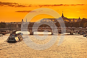 view Of Paris bridges, Grand Palace and cruise ship on the river Seine