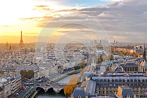 View of Paris skyline with colorful sunset light seen from the top of Notre Dame cathedral