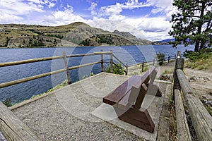 View of a park bench at Kalamalka Lake from Kalamalka Lake Provinial Park near Vernon British Columbia Canada