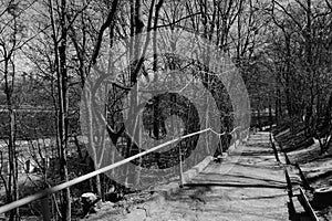 View of the park over the embankment of the highway from the old, dilapidated stairs.