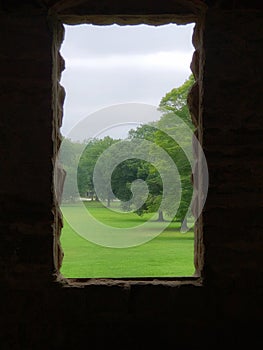 View of a park from a window at Squire Castle in the Cleveland Metroparks in Ohio