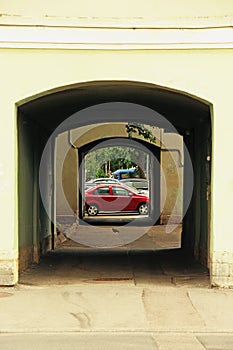 View of parked cars through two arches