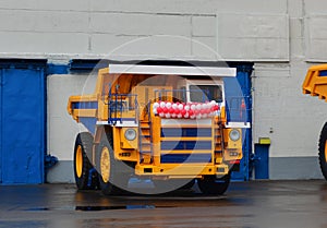 View of the parking lot of an exhibition of large career heavy dump trucks at the automobile plant Belaz