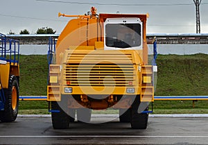 View of the parking lot of an exhibition of large career heavy dump trucks at the automobile plant Belaz