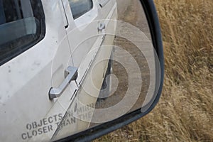 View in passenger side mirror on truck