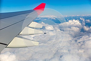 View from passenger window of flying airplane wing