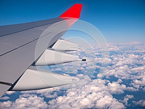 View from passenger window of flying airplane wing