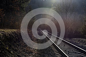 View of the passing tracks with reflections of the setting sun
