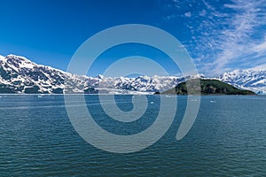 A view past Haenke Island towards the glaciers of Disenchartment Bay in Alaska