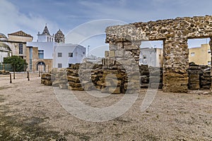 A view past the ruins of the roman ampitheatre in the city of Cadiz