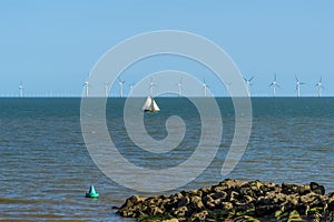 A view past sea defenses out to sea at Clacton on Sea, UK