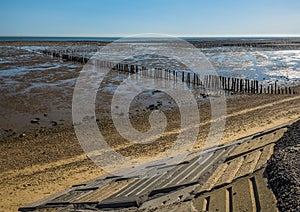 A view past sea defenses out to sea from the East Mersea flats, UK