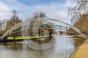 A view past the suspension bridge over the River Great Ouse towards Bedford, UK