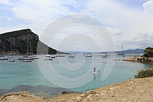 View from the path of the English cemetery. Dramatic sky with rain on Olbia. Cala moresca, Golfo Aranci, Sardinia