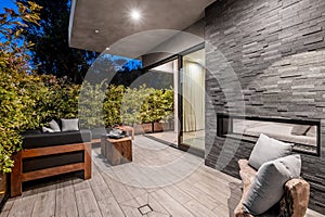 a view of the patio in front of a brick wall and wood paneling