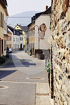 View of the paved street with traditional medieval houses