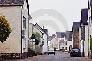 View of the paved street with traditional medieval houses