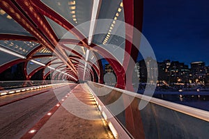 Walking Through An Illuminated Peace Bridge