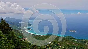 View from the peak of Morne Blanc, Mahe, Seychelles over west coast and south of the island with rainforest and tropical beach.