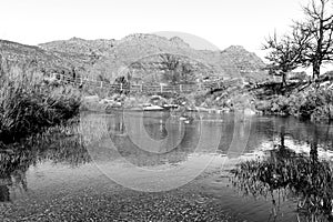 View of the pedestrian bridge over the Krom River. Monochrome