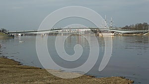 View on the pedestrian bridge over the Volkhov river in April afternoon. Veliky Novgorod, Russia