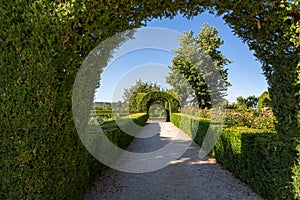 View of a pedestrian path on iconic and geometric classic baroque garden