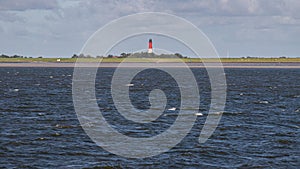 View of the Pellworm lighthouse from the Watt