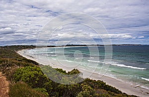 The view of Pennington Bay with coastal bush, beach, sea and surf on Kangaroo Island in South Australia, Australia.