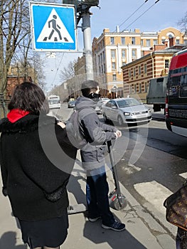 View of people in front of a pedestrian crossing