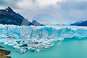 View of Perito Moreno Glacier with Iceberg floating in Argentina lake
