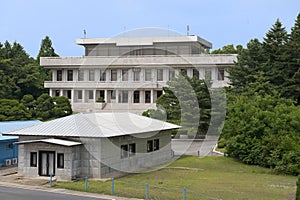 A view of the Phanmun Pavilion and a white North Korean conference building that straddles the Military Demarcation Line. photo