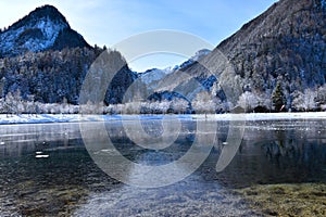 View of PiÅ¡nica valley and frozen lake Jasna near Kranjska Gora