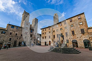 View of Piazza della Cisterna in the medieval town of San Gimignano, Tuscany, Italy