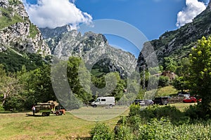 View at the Picos de Europa, or Peaks of Europe, CaÃ­m de Valdeon village, mountain range extending for about 20 km photo