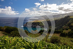 View of a picturesque landscape stretching towards a deep blue ocean: Ponta Delgada, Portuga