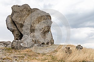 View on Pidkamin inselberg on adjacent hill and nearby ancient graveyard in Brody region of Galychyna photo