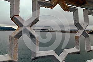 View from the pier between the railing, Llandudno in Wales United Kingdon photo