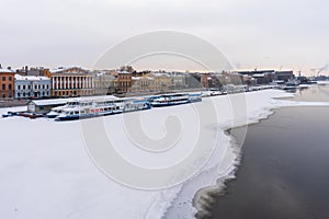 St. Petersburg, Russia, February 10, 2024. View of the Neva River embankment with a parking lot for motor ships.