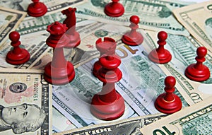 View on pile paper money us dollar banknotes with group red chess pieces