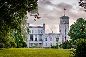 View of the pink castle through the park.