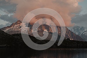 View of pink clouds covering the Mont Blanc massif mountaintop