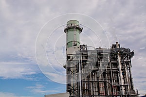 View of pipelines and towers, heavy industry.